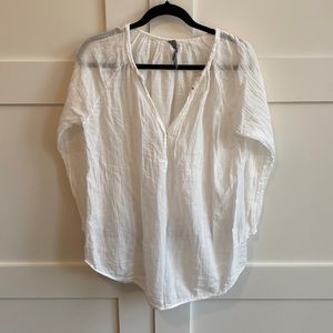 Raquel Allegra linen long sleeve lightweight top with tiny snaps half way down.